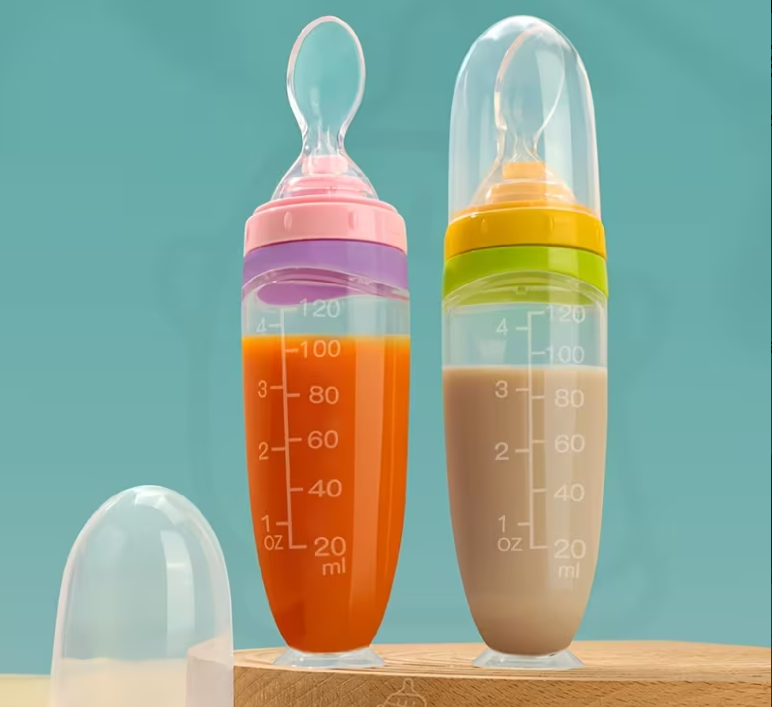 AWE™ Squeeze Spoon Feeder in pink and yellow variants
